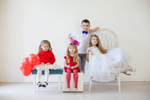 Boy and girls on red white birthday party