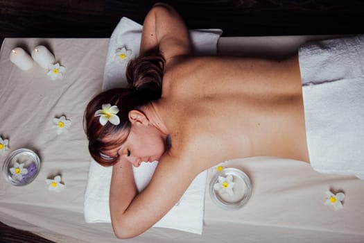 the beautiful girl lying in Spa massage sauna procedures