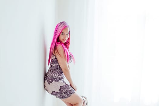 beautiful girl with pink hair posing at photoshoot 1