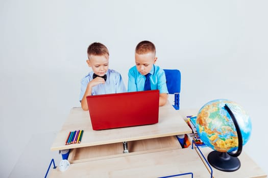 boys at a computer on the Internet school lessons 1