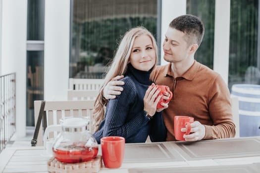 husband and wife on holiday drink hot chocolate coffee tea 1