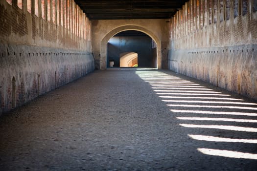 A tunnel with a light at the end of it. Photo of a tunnel with a captivating light at the end, beckoning with a sense of mystery and possibility