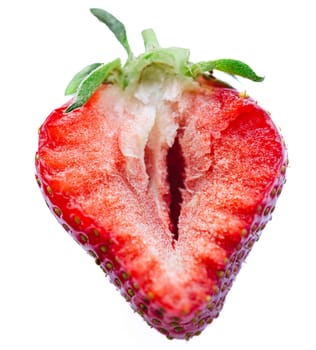 Ripe half of a strawberry on a white background. Shallow dof