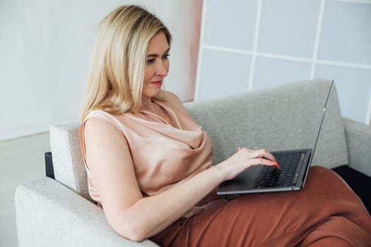 Woman working remotely on laptop online finance