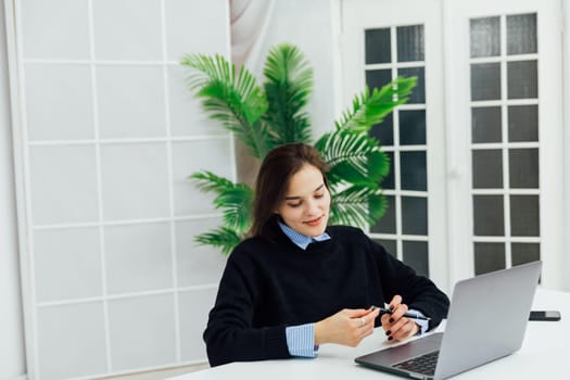 woman working on laptop online finance in office