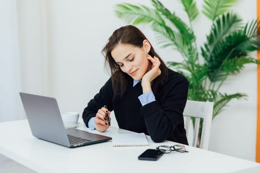 Woman working on laptop financial business from office