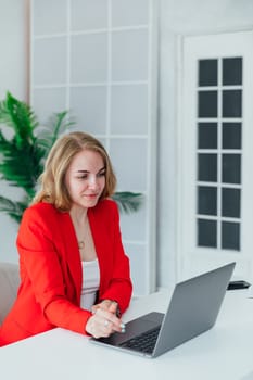Business woman running on laptop finance business online