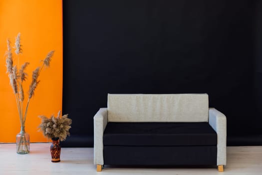 sofa in the interior of a black and orange room