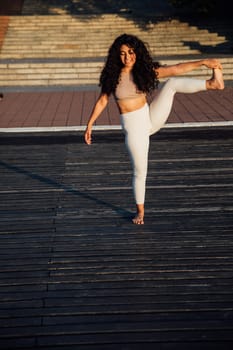 Woman doing yoga asana breathing practice stretching