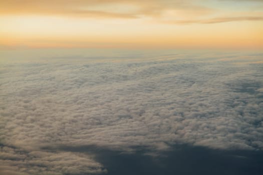 the sky above the clouds from aircraft iljuminatora at sunset