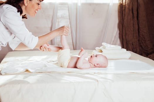 the little boy baby doctor doing massage hands and legs