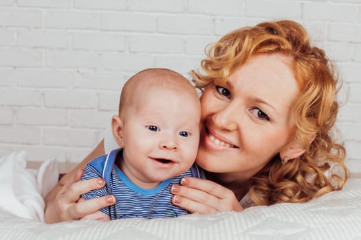 Portrait of a mother with a baby in her arms her son love