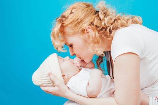 mom in white clothes with her son baby in love happiness