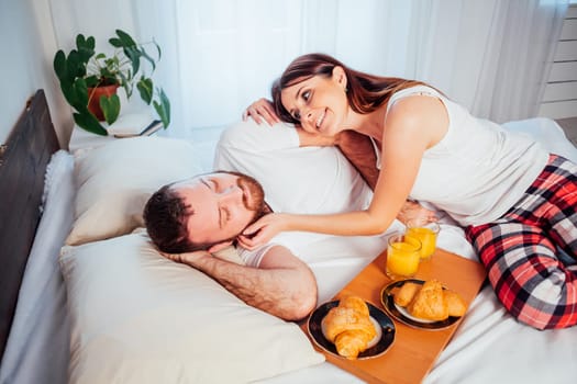 man and woman breakfast in bed nice