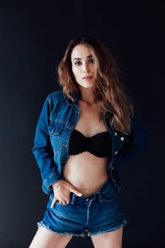 portrait of a beautiful woman in lingerie and denim shorts