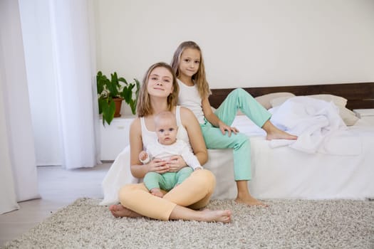 sisters on the bed in the bedroom in the morning