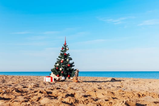 Christmas tree with the gift of tropical resort on the beach 1