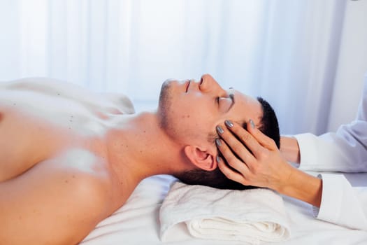 male masseur doing massage health spa procedure 1