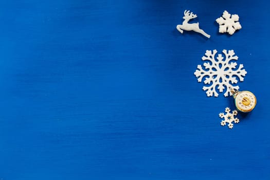 Christmas toys snowflakes the new year on a blue background