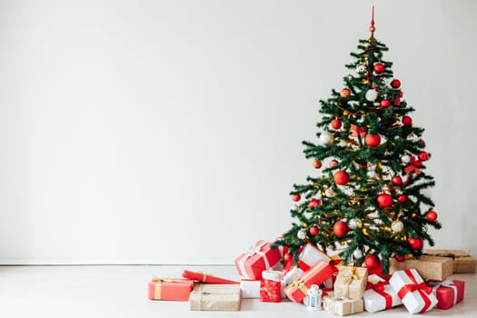 Christmas tree with gifts of red decor for the new year winter