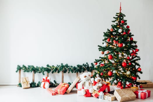 Christmas tree with gifts of red decor for the new year winter