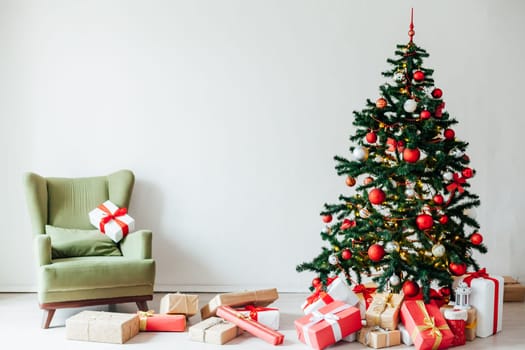 Christmas tree with gifts of red decor for the new year winter