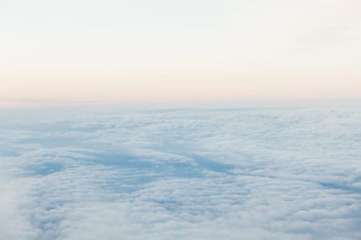 the sky above the clouds from aircraft iljuminatora at sunset