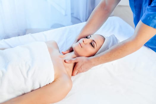 girl masseur doing massage in spa health 1
