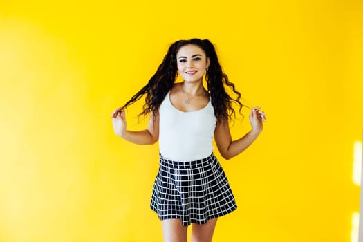 portrait of a beautiful woman on a yellow background