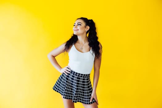 portrait of a beautiful woman on a yellow background