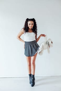 Portrait of a beautiful woman with a soft polar bear toy