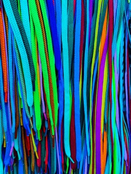 multi-colored shoelaces as a colored background
