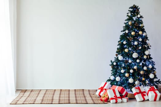 decor of the house with christmas tree with New Year's gifts