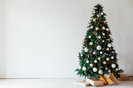 decor of the house with christmas tree with New Year's gifts