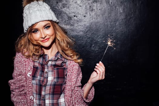 nice girl on holiday holding sparklers 1