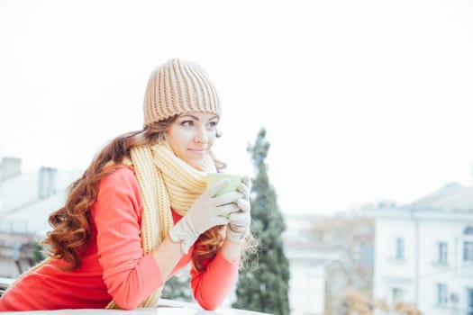 the girl in the hat froze and drinking hot tea1