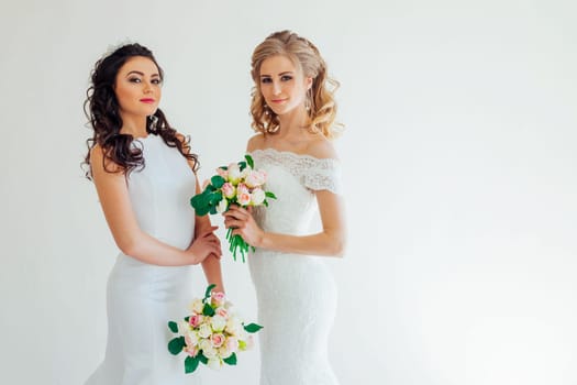 two wedding bride with bouquet wedding hairstyle