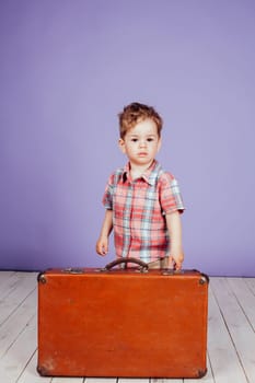 little boy going on a journey with a suitcase