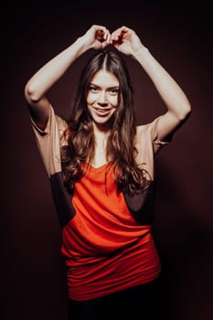 beautiful girl with long hair posing in the Studio smiling
