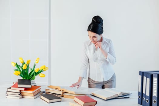 business girl sits in the Office paper folders Secretary 1