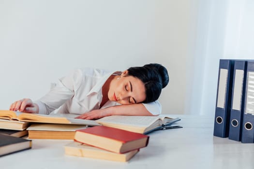 the woman fell asleep at the table reading a book 1