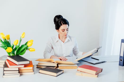 teacher business Lady reads books in the Office 1