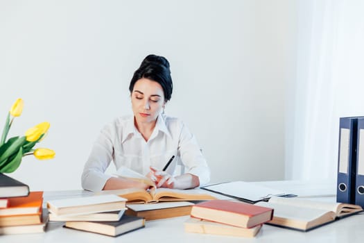 teacher business Lady reads books in the Office 1