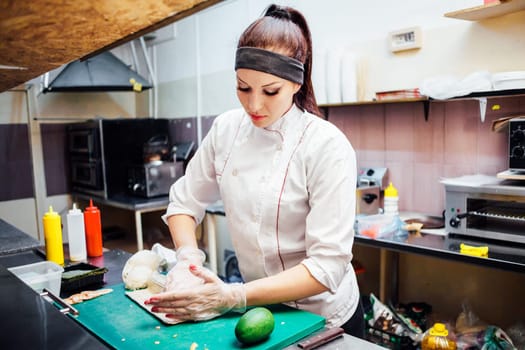female chef preparing a sushi restaurant in the kitchen 1