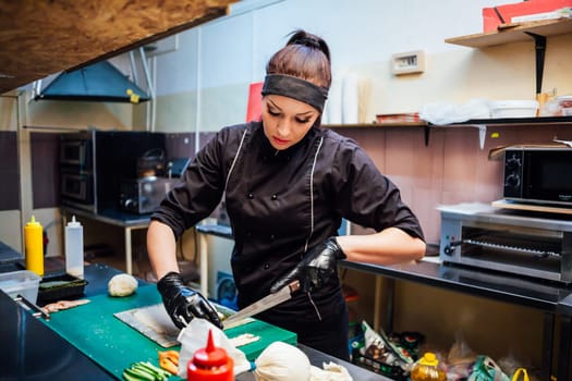 the Cook woman prepares food sushi restaurant kitchen 1