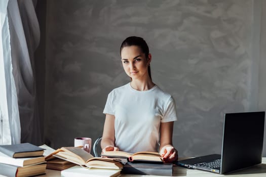 girl is preparing for the exam reading book works