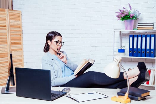 business woman in an Office works at the computer new