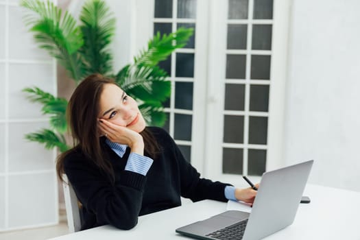 woman working on laptop online finance in office