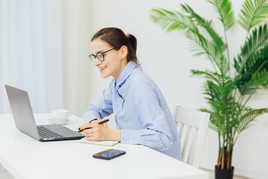 Woman working on laptop financial business from office