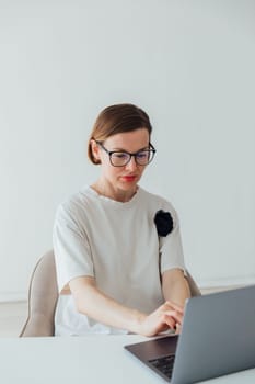 woman working on laptop in office finance online